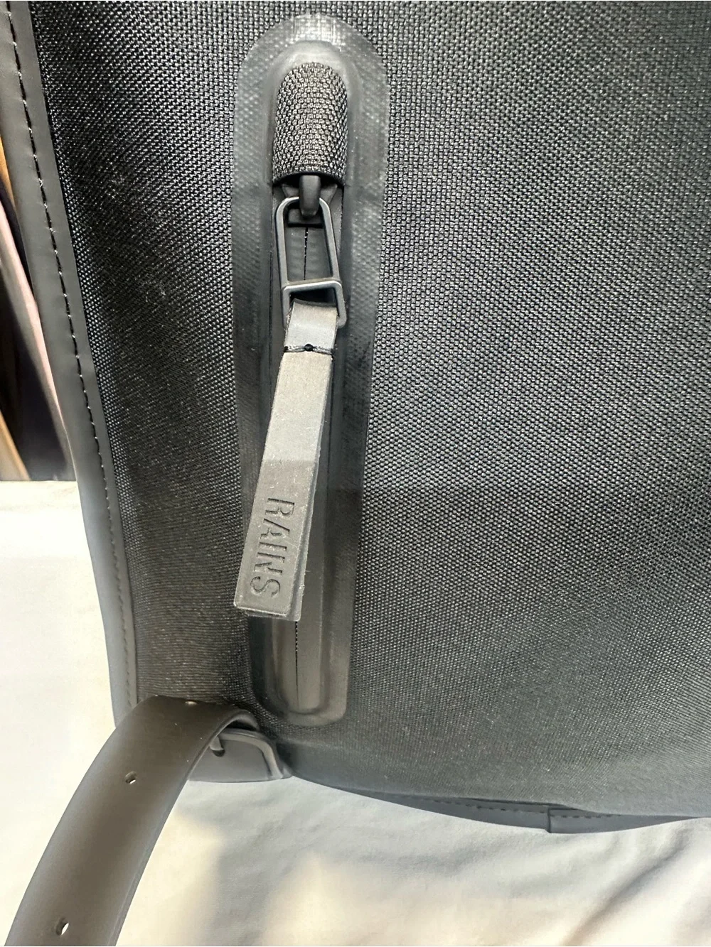 Rains  Backpack is clean and ever-contemporary. Like new no tag